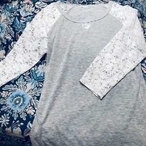 Gray and white lace shirt.